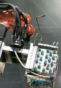 Robots handling engine block cast
